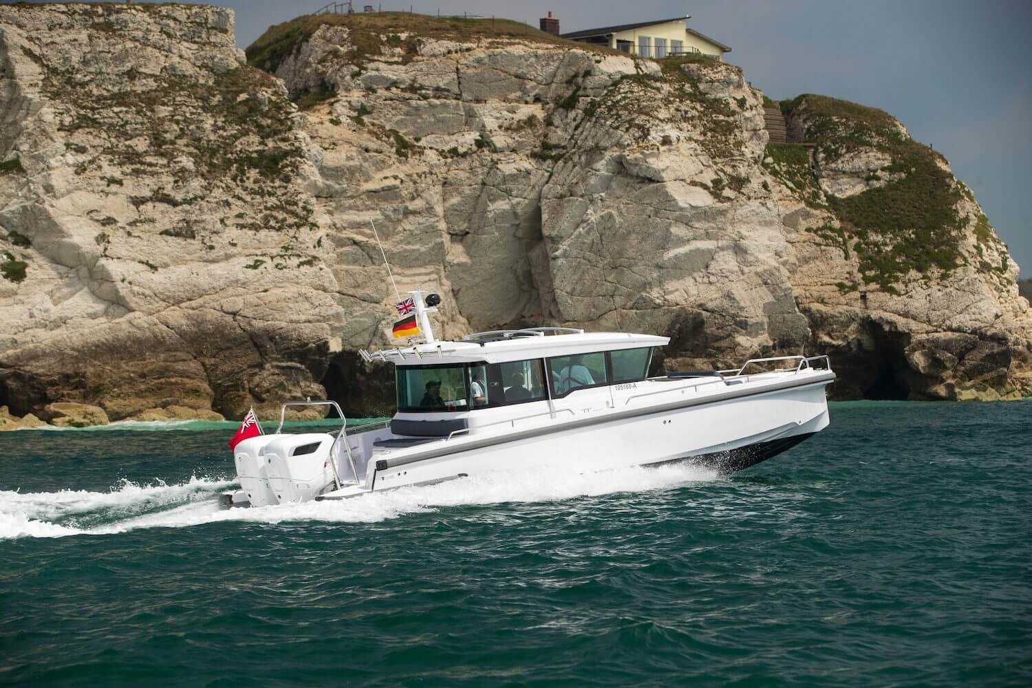 white boat sailing in sea